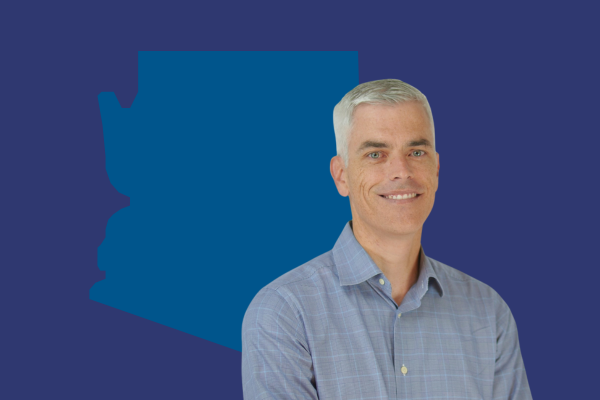 Photo of Phoenix Director Ben Hays in front of the state of Arizona, representing YPTC presence in Phoenix, Tuscon, Scottsdale and all of Phoenix providing award-winning nonprofit accounting services